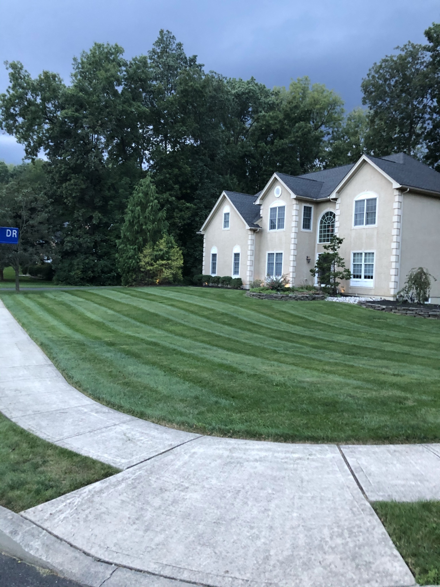 Elegant home with perfectly striped front lawn